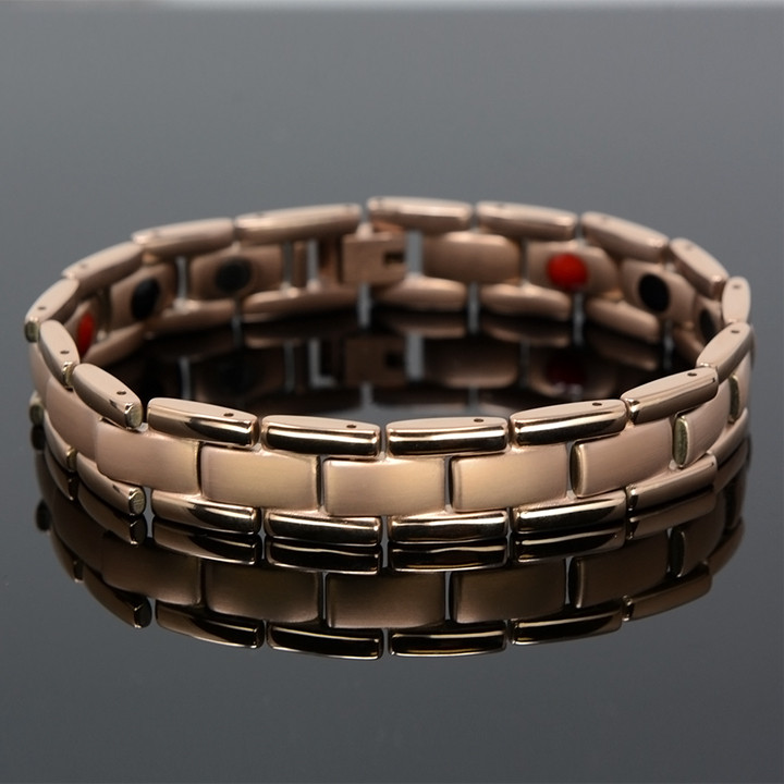 <img src="mens gold color magnet bracelet .png" alt="casual magnetic therapy jewelry  strong  side  view    magnetic-bracelet-jewelry   Novoa Men's Rose Gold Colored    Novoa Men's Quad-Element Rose Gold Colored Titanium Magnetic Bracelet  ">