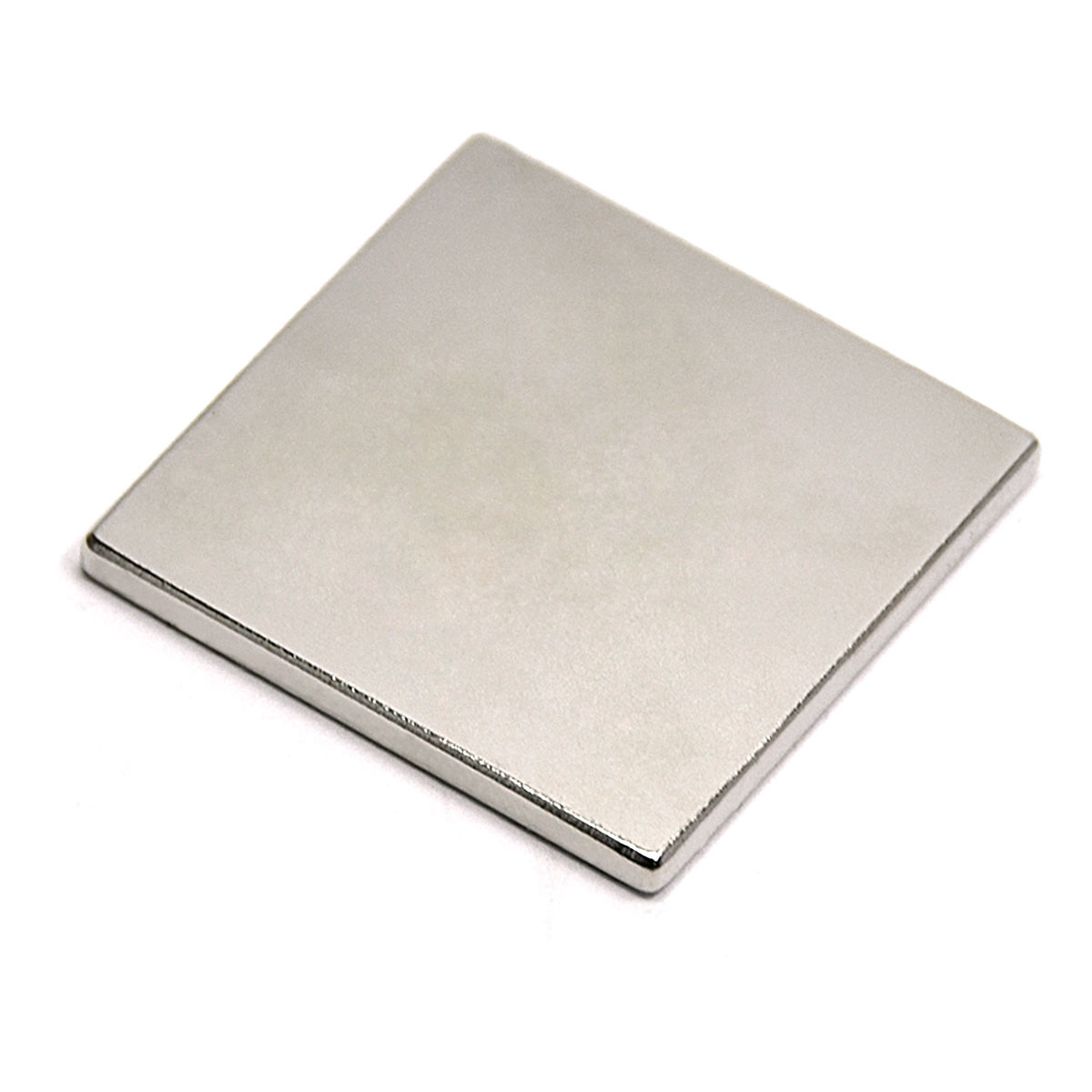 Handheld scale of 1.5 inch Square N45 Neodymium Magnet showing size and Ni-Cu-Ni coating