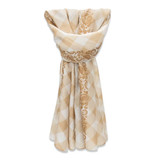 A lightweight scarf featuring a cream and beige patterned design, styled elegantly in a loop.