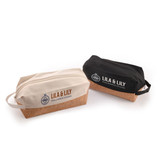 Two utility pouches, one beige and one black, featuring a cork bottom and a logo on each.