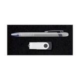 A silver pen and a white USB drive displayed on a black background, part of the Alliance Gift Set.