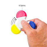 A hand holds a spinner highlighter featuring red, yellow, and blue ends, designed to spin. The product also has a white centre.