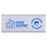 A transparent ruler featuring a blue logo, marked in centimetres and inches, with a whimsical design element.