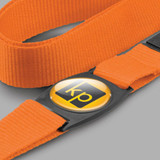 An orange strap with a circular label featuring a logo in black and yellow.