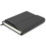 A grey notebook with a textured cover and a ribbon bookmark, featuring a flap closure and blank pages.