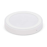 A wireless charger in a sleek, round design with a smooth white finish. The charger features an LED indicator light.