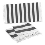 A striped black and white cotton towel with tassels, featuring a flat and folded design.