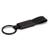 A black key ring featuring a sleek metal attachment and a leather strap. It includes a branding logo.