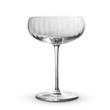 A clear glass cocktail glass with a ribbed design and a long stem, featuring a smooth, elegant bowl.