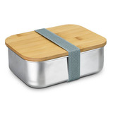 A stainless steel lunch box with a bamboo lid, secured by a grey elastic strap. It has a shiny silver base.