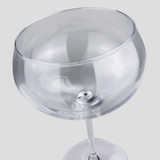 A Jenever gin glass with a clear, round bowl and a slender stem, featuring a simple design.