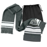 A grey scarf with white stripes and a matching grey beanie with a pom pom, packaged in a black drawstring bag.