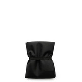 A reusable grocery bag in black, compactly folded with an elastic band securing it.