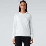 A long-sleeve white T-shirt featuring a fitted design, paired with dark jeans. It has a logo on the front.