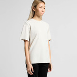 A light beige heavy faded tee displayed on a model, featuring short sleeves and a relaxed fit.