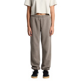 Faded track pants in grey, featuring a relaxed fit with elastic cuffs and waistband, modelled by a person.