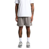 A person wearing grey Relax Faded Track Shorts, standing upright in a white t-shirt and athletic shoes.
