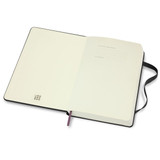 An open black Moleskine 2026 Daily Planner featuring blank pages and a ribbon bookmark. It has a logo on the cover.