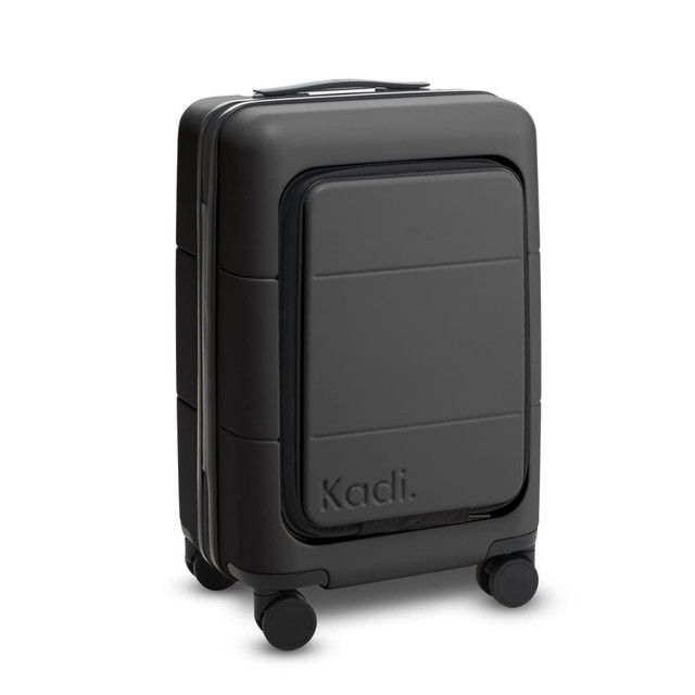 A black carry-on suitcase with a sleek design and wheels, featuring a logo on the side.