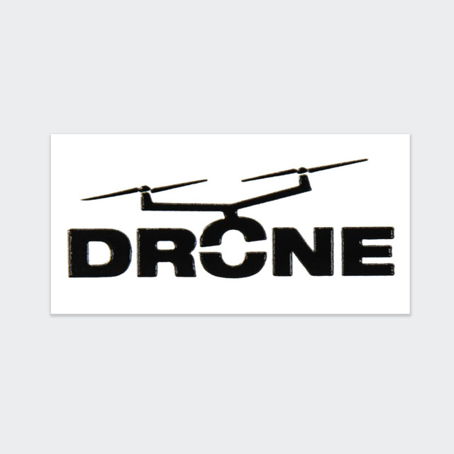A black sticker featuring a silhouette of a drone above the word "DRONE" in bold letters.