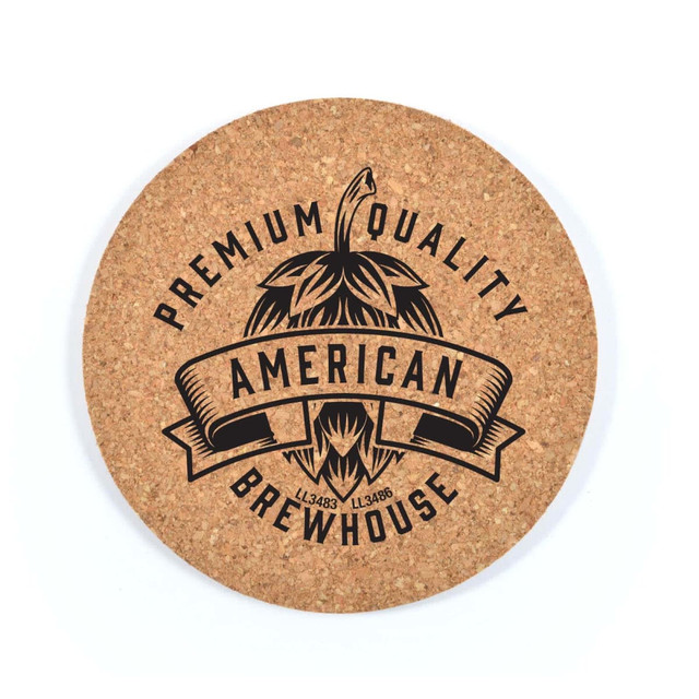 A round cork coaster featuring a black design with bold text and a logo, showcasing a rustic, natural look.