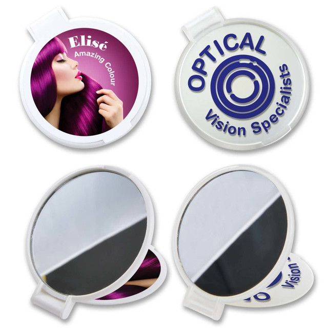 Round folding mirror with a colorful design featuring a woman with vibrant purple hair. White casing with a logo.