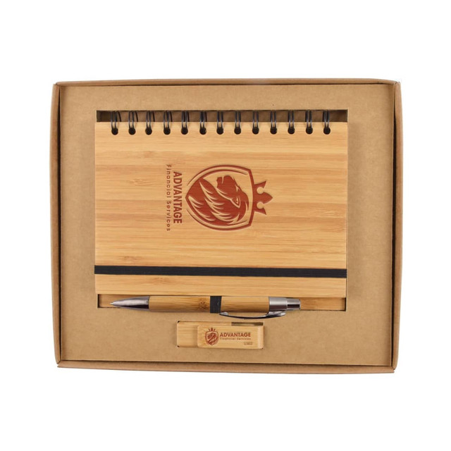 A bamboo notebook with a spiral binding, a pen, and a wooden USB drive, all presented in a cardboard gift box.