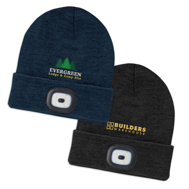 A navy beanie with a headlamp and logo, alongside a black beanie with a headlamp and another logo.