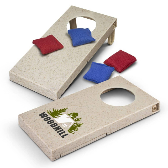 A cornhole game set featuring two wooden boards in light tan with a logo, accompanied by blue and red bean bags.