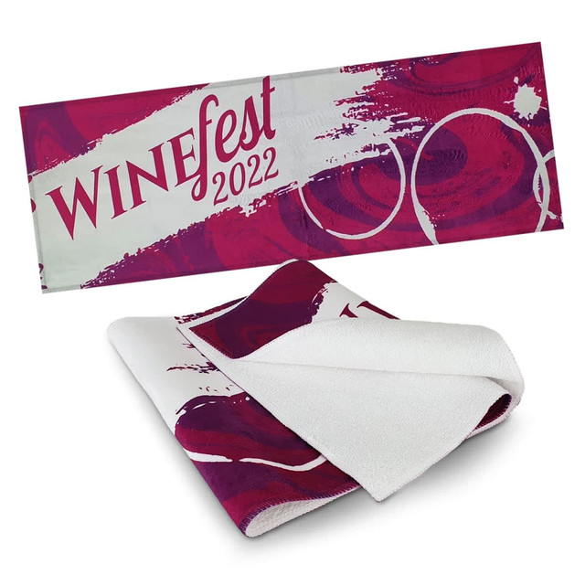A full-colour bar towel featuring a vibrant design in shades of purple and white, with a branding logo included.