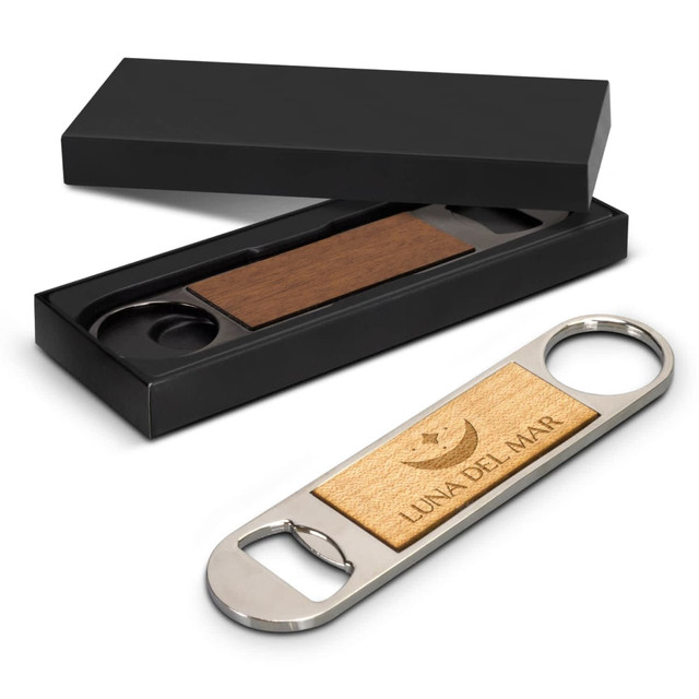 A drink bottle opener with a wooden top and metal body, presented in a black gift box. It has a brand logo.