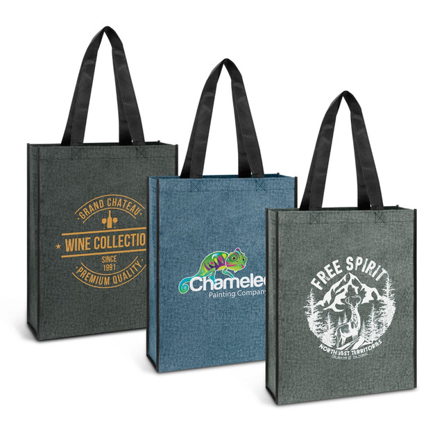 Three tote bags in dark green and denim with various logos and designs on each bag.