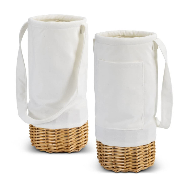 A white fabric wine carrier with a wicker base and a shoulder strap, featuring a side pocket.