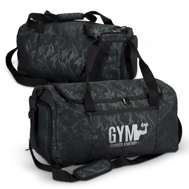 A black urban camouflage duffle bag with dual handles and a shoulder strap, featuring a logo.