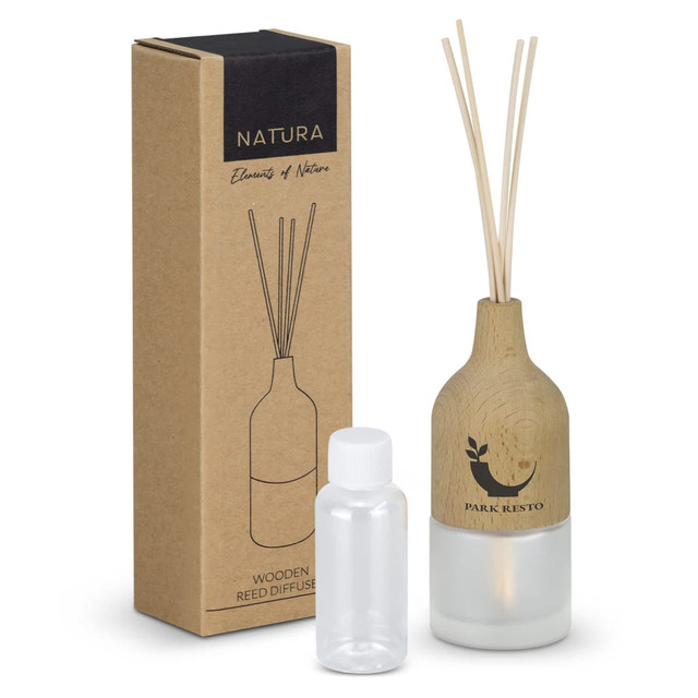A wooden reed diffuser in a frosted glass bottle, packaged in a simple brown box, featuring natural tones.