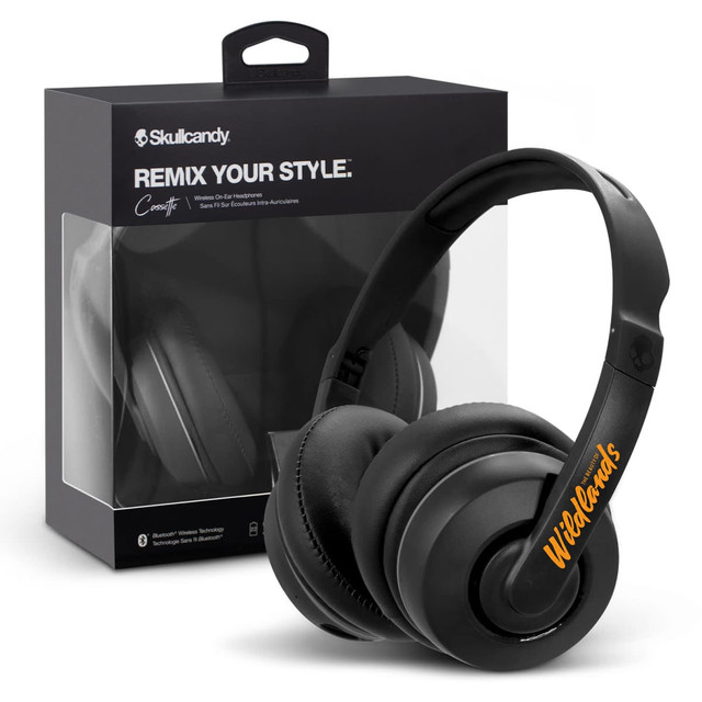 A pair of black Skullcandy Cassette headphones displayed next to its packaging, featuring a logo on the headphone band.