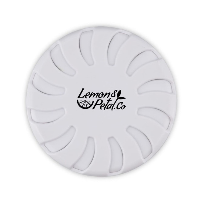A round white fragrance pot with a floral design and a logo in the centre.