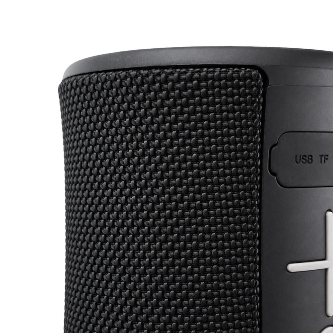 A black speaker with a textured surface and control buttons on the side, featuring a USB port.