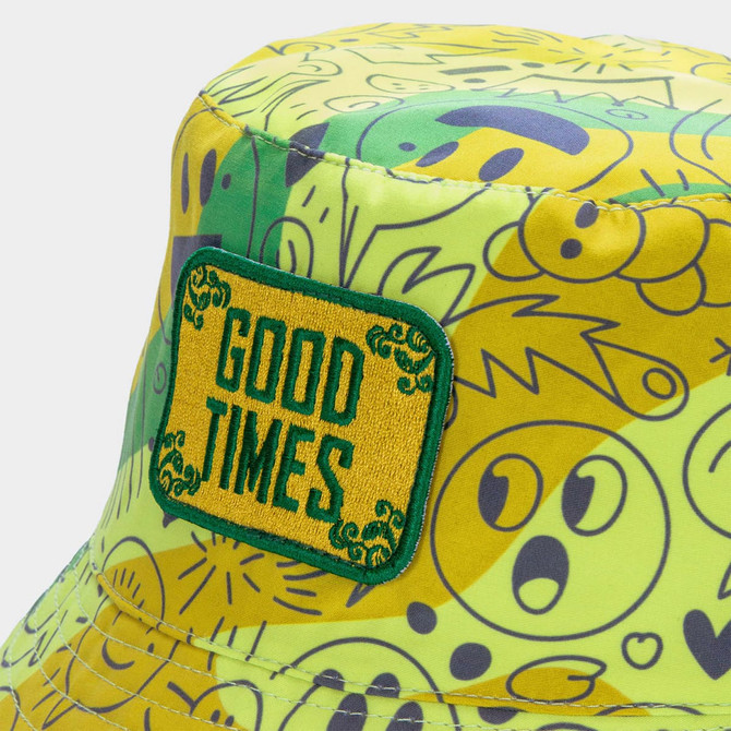 A vibrant yellow and green bucket hat featuring various playful patterns and an embroidered patch.