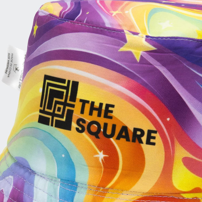 A vibrant, multicoloured reversible bucket hat with a logo featured on one side.