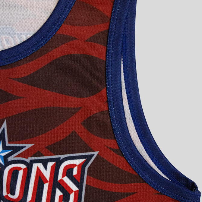 A custom youth active tank top featuring a red and brown design with blue trimming and a logo.