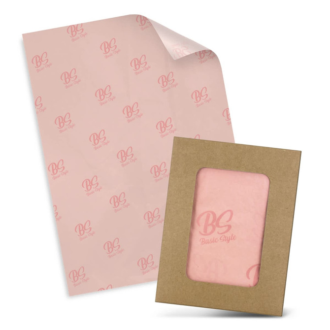 Tissue paper in soft pink with a matching envelope, featuring a logo on the tissue and an open frame design.