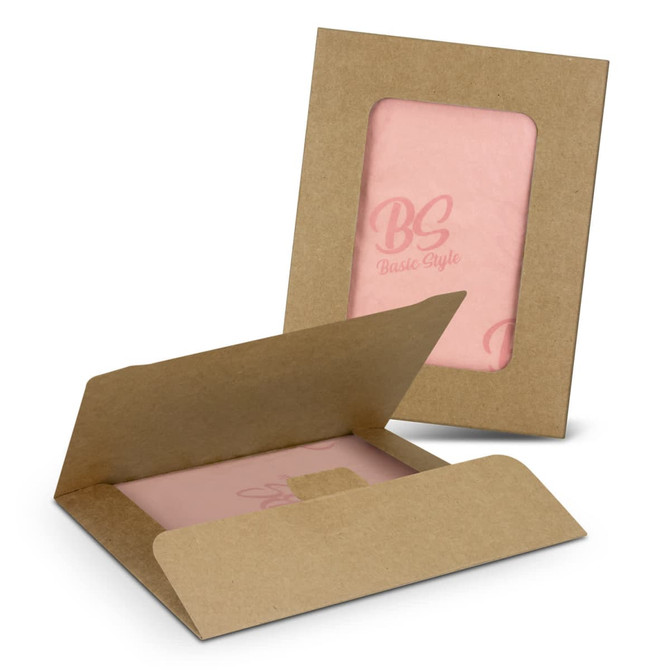 Tissue paper in soft pink, packed with a brown kraft envelope featuring a logo.