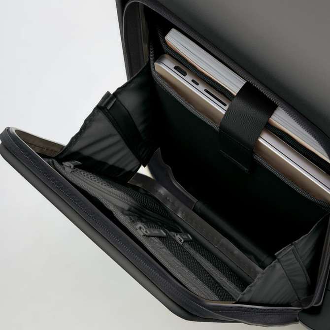 A black carry-on suitcase interior featuring compartments for a laptop and documents. It includes a logo.