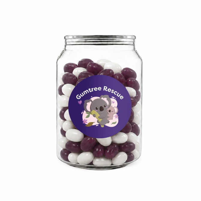 A clear jar filled with purple and white jelly beans. The jar features a colourful label with a logo.