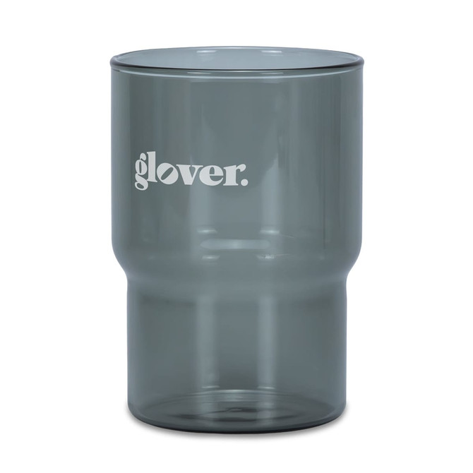 A drink tumbler in a smoky grey colour with a logo. Features a modern design suitable for various beverages.