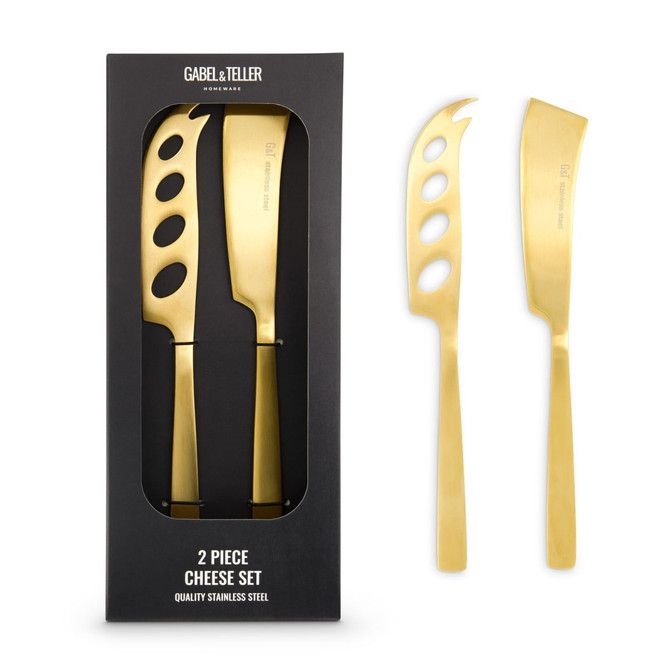 A cheese set featuring two stainless steel knives with a gold finish, presented in a black box.