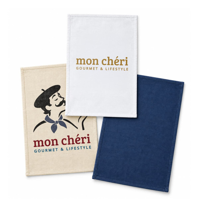 Three cotton tea towels in beige, white, and navy, featuring a logo and various designs.