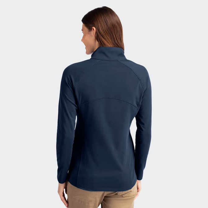 A women's half-zip top in navy, featuring a high collar and a fitted design, with a logo on the back.