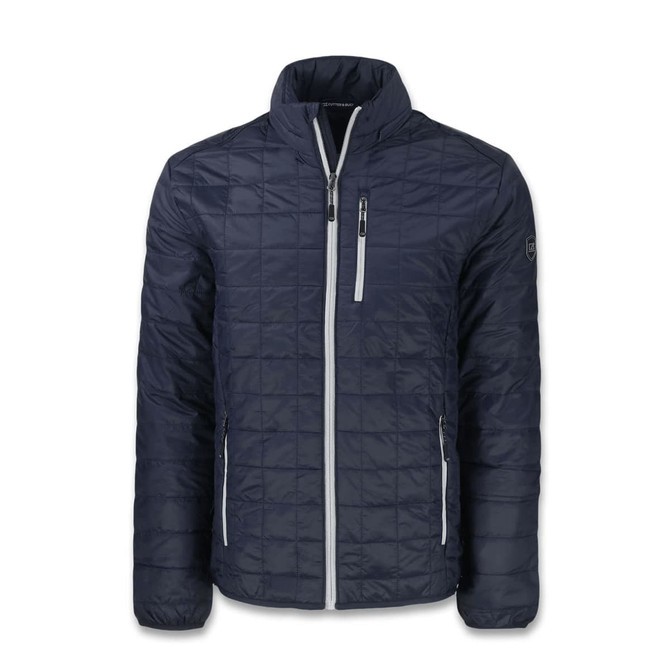 A navy quilted jacket featuring a zip front and grey accents, with pockets and a logo on one sleeve.